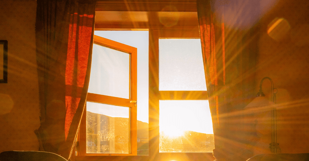 image of hot sun shining through window to a home